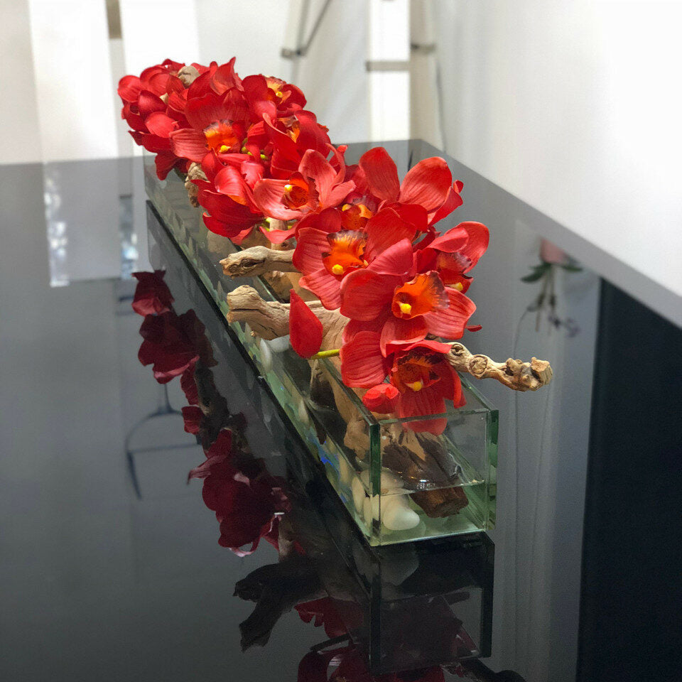 Maceta de vidrio moderna de 122 cm con cymbidiums rojos