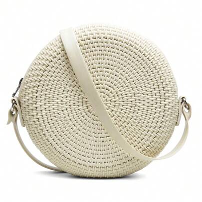 Bolso de hombro redondo con cremallera y asa cruzada.